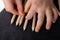 Closeup shot of a child\'s hands with fingers separating colorful pencils