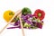 Closeup shot of chopped lettuce and cabbage with peppers and wooden spoons on a white background