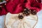 Closeup shot of Christmas tree bumps on a plate and red fabric on a table