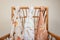 Closeup shot of colorful authentic fabrics hanging from a wooden chair