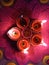 closeup shot of colorful handmade earthen lamps or panch pradip lit during the Deepawali festival