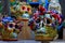 Closeup shot of colorful skull statues on a wooden shelf