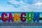 Closeup shot of the colorful word Cancun on the seashore on a bright day in Mexico
