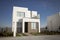 Closeup shot of a complex of white and brown modern building blocks with sunshine