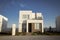 Closeup shot of a complex of white and brown modern building blocks with sunshine