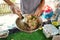 Closeup shot of a cook with a plate of noodles