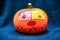 Closeup shot of a cute painted pumpkin for Halloween