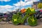 Closeup shot of a decorative grass bicycle parked close to other bikes in a street in Amsterdam