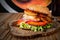 Closeup shot of delicious burger with a glass of coke with ice