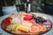 Closeup shot of a delicious charcuterie board with cheeses and fruits