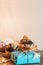 Closeup shot of delicious donuts next to a gift wrap in celebration of Jewish Hanukkah holiday