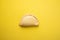 Closeup shot of a delicious empanada isolated on a yellow background