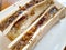 Closeup shot of delicious pair of bone marrow topped with fried garlic.