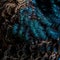 Closeup shot of the details of the colorful plumage of a young blue Indian peafowl