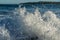 Closeup shot of the drops of the foamy ocean water in the air - capturing moments concept