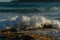 Closeup shot of the drops of the foamy ocean water in the air - capturing moments concept