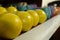 Closeup shot of dumbbells of different weight and color on a shelf