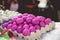 Closeup shot of eggs dyed in pink with a blurred background