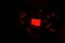 Closeup shot of the electronic instrument cluster in red lights in the darkness