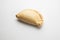 Closeup shot of an Empanada isolated on a white background