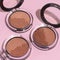 Closeup shot of face powder for makeup, bronzer, blusher, and highlighter
