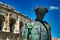 Closeup shot of the famous Statue of a Matador in Nimes against an old building in France