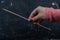 Closeup shot of a female hand holding a brochette wooden sticks