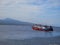 Closeup shot of a ferry speeding across the Bali strait