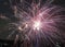 A closeup shot of festive fireworks spreading happiness in the night sky