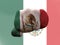 Closeup shot of a flag of Mexico painted on male fist
