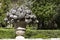 Closeup shot of a floral sculpture fountain in a park