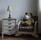 Closeup shot of a fluffy bear toy wearing a cover mask indoors