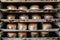 Closeup shot of a four tray oven with cakes being baked in metallic molds