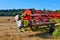 Closeup shot of  freshly harvested crops by a harvesting machine during a sunny day