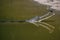 Closeup shot of a gharial reptile swimming in a dirty pond