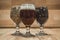 Closeup shot of a glass of craft beer and glasses filled with malted barley in used for beer brewing