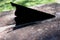 Closeup shot of a gnomon of a sundial on an old rusted metal surface