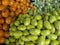 Closeup shot of green and orange olives bunch