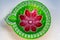 Closeup shot of a green and red Festival Diya Set for Decoration. Handmade Clay Diya for Diwali