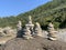 Closeup shot of hand-building stone in beach stack of stones