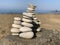 Closeup shot of hand-building stone in beach stack of stones