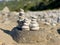 Closeup shot of hand-building stone in beach stack of stones