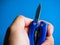 Closeup shot of a hand holding a blade on a pocket utility tool