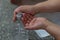 Closeup shot of hands pumping sanitizer out of a plastic bottle-concept new normal