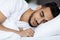 Closeup Shot Of Handsome Young Arab Man Sleeping In Comfortable Bed