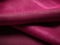 A closeup shot of a hardy magenta canvas fabric its tightly woven cloth ideal for upholstery. Trendy color of 2023 Viva