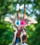 Closeup shot of the head of a person in an Native American festive hat with feathers