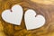 Closeup shot of a hearts of wood on wooden background