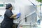 Closeup shot of a hospital cook in black uniform disinfecting hospital kitchen