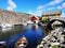 Closeup shot of houses and multicolored boats in the water in Gjeving, Norway